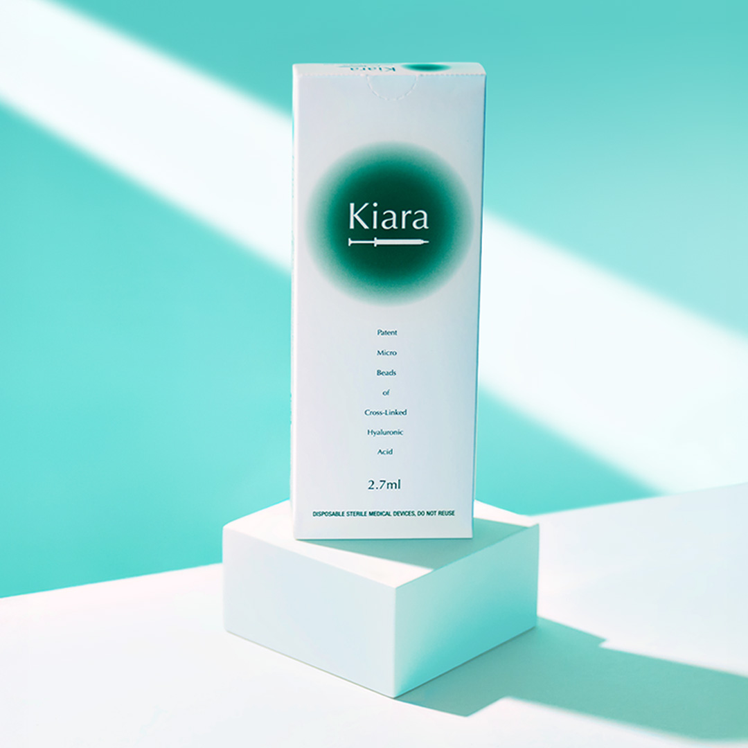 Kiara skin booster on a white podium and turquoise background