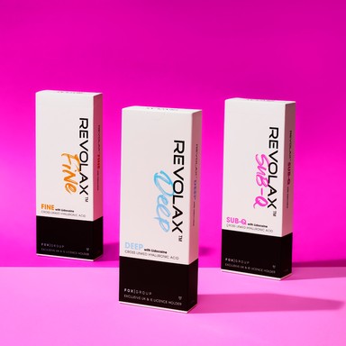 Full REVOLAX dermal filler range, featuring Revolax Fine, Revolax Deep, and Revolax Sub-Q located on a pink gradient background, highlighting the boxes branding