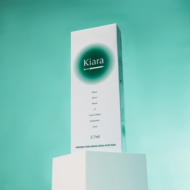 Kiara Skin Booster box located on a green gradient background