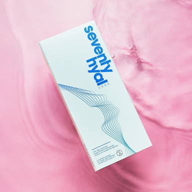 Seventy Hyal Triple box located on a pink water ripple effect background, highlighting the boxes branding